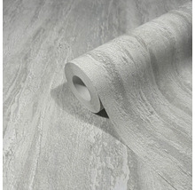 Eine Rolle Tapete mit Steinmuster.