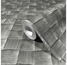 Un rouleau de papier peint avec un motif tressé