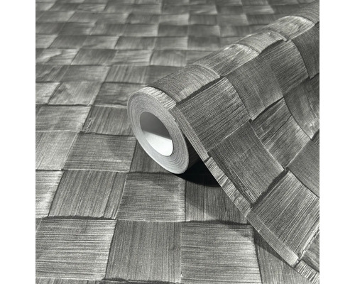 Un rouleau de papier peint avec un motif tressé