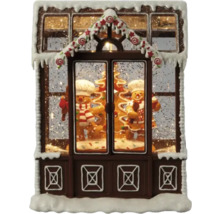 Maison en pain d''épices décorative avec des bonshommes en pain d''épices et de la neige comme décoration de Noël