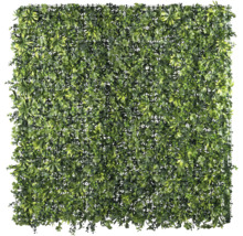 Tapis de gazon artificiel avec différentes feuilles vertes