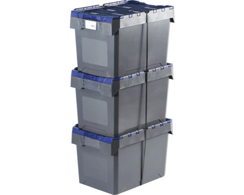 Trois boîtes de rangement en plastique gris, empilées et fixées par des sangles.