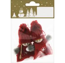 Zwei Weihnachtsbaumfiguren in einer Verpackung.
