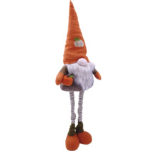 Gnome d''automne décoratif avec jambes rayées et citrouille