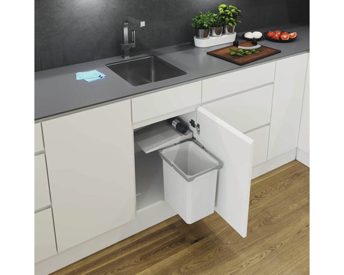 Évier de cuisine avec poubelle intégrée dans une armoire blanche