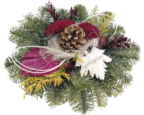 Arrangement avec branches de sapin, pommes de pin et pendentif en forme de feuille