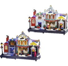 Zwei weihnachtliche Häuser mit Figuren und Beleuchtung.