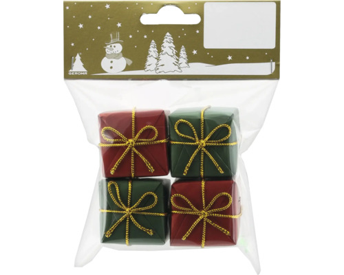 Verpackung mit vier kleinen Geschenkboxen in Rot und Grün mit goldener Schleife als Weihnachtsdekoration