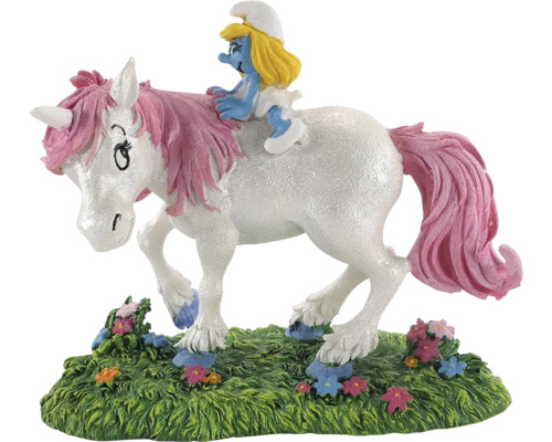 Schtroumpfette chevauche une figurine de licorne sur une pelouse