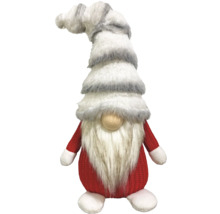 Nain de Noël avec barbe en fourrure et bonnet rayé