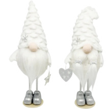 Deux gnomes décoratifs blancs avec des bonnets en forme de sapin de Noël comme décoration de Noël