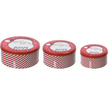 Trois boîtes de conserve rondes avec motif de Noël et rayures
