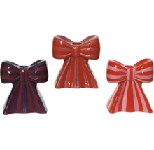 Trois bougeoirs rayés en forme de nœuds