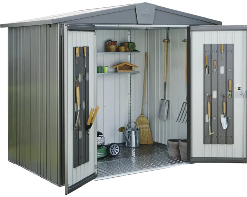 Abri de jardin avec étagères et outils