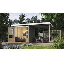 Abri de jardin avec terrasse, mobilier de jardin et plantes dans le jardin