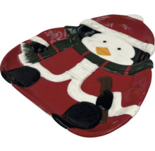 Plat de service décoratif avec motif pingouin pour les occasions festives.