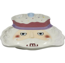 Plat décoratif en céramique avec visage et coiffe