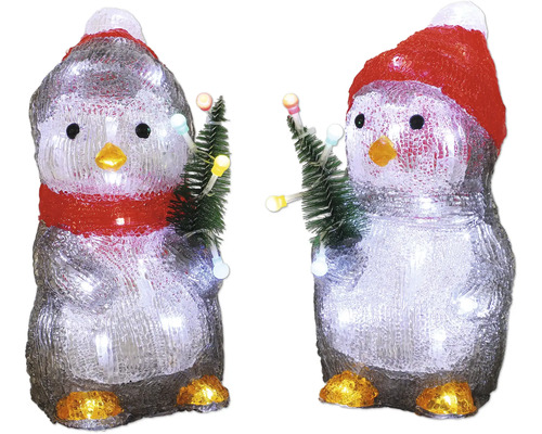 Zwei dekorative Pinguine mit Mütze und Tannenbaum