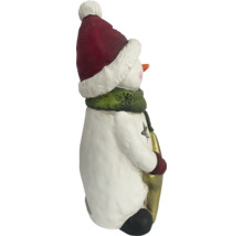 Figurine de bonhomme de neige avec bonnet, écharpe et lanterne comme décoration de Noël