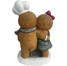 Figurines décoratives en pain d''épices s''embrassant, un boulanger avec une toque et une fille avec un nœud