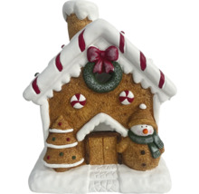 Lebkuchenhaus-Dekoration mit Weihnachtsbaum und Schneemann
