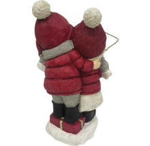 Dekorative Winterkinderfigur mit Mützen und Jacken