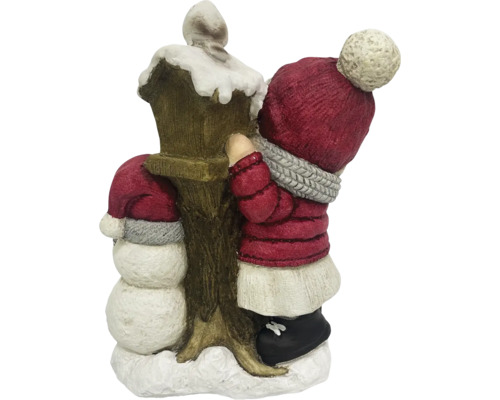 Décoration de Noël avec bonhomme de neige et enfant près d''une lanterne