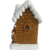 Dekoratives Lebkuchenhaus mit Schnee auf dem Dach.