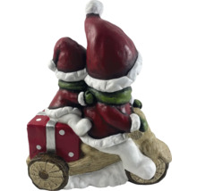 Décoration de Noël avec deux lutins sur une moto avec un cadeau