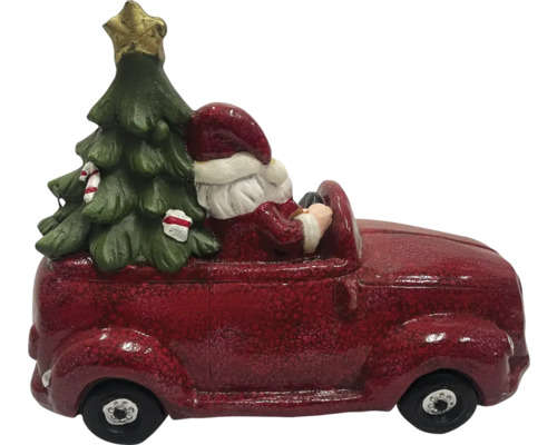 Weihnachtsdekoration: Weihnachtsmann fährt mit Weihnachtsbaum im Auto