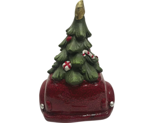 Dekorative Weihnachtsbaumfigur auf rotem Auto