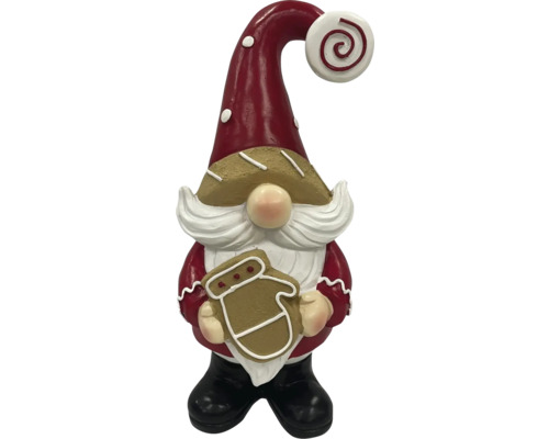 Nain de Noël décoratif tenant un pain d''épices à la main comme décoration de Noël