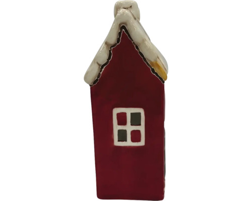 Dekorative Hausfigur mit Schnee auf dem Dach und Fenster