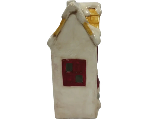 Maison décorative en céramique avec de la neige sur le toit et une cheminée.