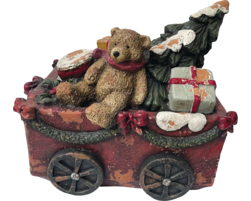 Dekorative Weihnachtsszene mit Teddybär, Baum und Geschenken auf einem Wagen