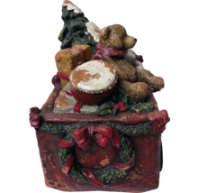 Dekorative Weihnachtsfigur mit Teddybär, Trommel und Weihnachtsbaum in einer Schachtel.