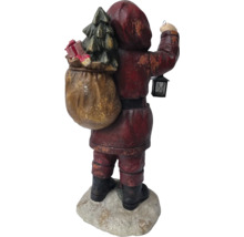 Figurine du Père Noël avec sapin et lanterne