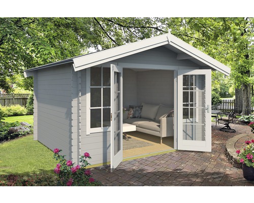 Abri de jardin avec double porte et fenêtres dans le jardin