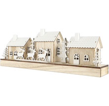 Maisons décoratives en bois avec des rennes et des arbres comme décoration de Noël