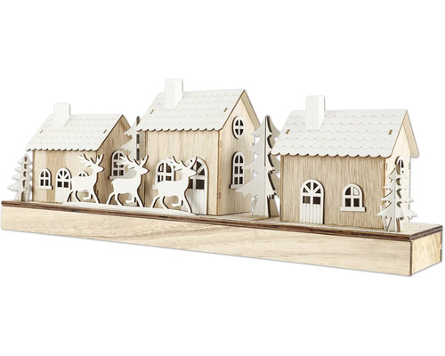 Maisons décoratives en bois avec des rennes et des arbres comme décoration de Noël