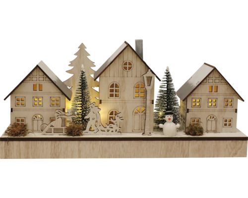 Décoration en bois illuminée avec maisons, sapins et bonhomme de neige pour la période de Noël