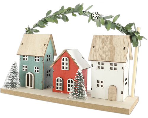 Dekorative Holzhaus-Szene mit drei Häusern und Girlande