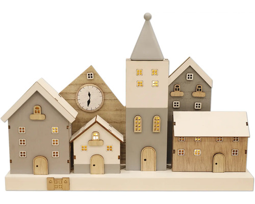 Dekorative Häusergruppe mit Uhr und Beleuchtung für die Weihnachtszeit