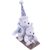 Ours polaires décoratifs sur luge avec bonnet et écharpe