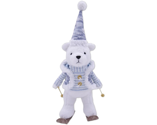 Ours polaire décoratif avec bonnet, écharpe et skis comme décoration de Noël.