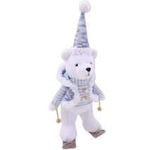 Ours polaire décoratif avec bonnet et skis comme décoration de Noël