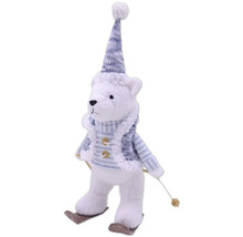 Ours en peluche décoratif avec bonnet et skis comme décoration de Noël