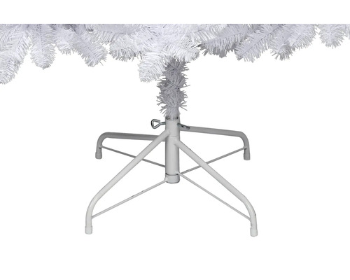 Gros plan sur le pied de sapin de Noël blanc en métal