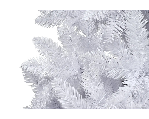 Gros plan sur un sapin de Noël artificiel blanc.