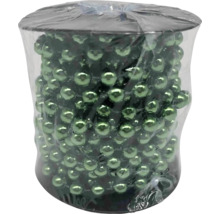 Guirlande avec perles vertes dans un emballage transparent